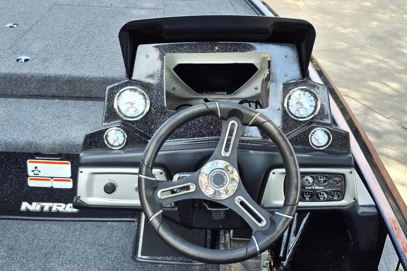 Slide: The Image of Steering console of a 2020 Nitro Z19 Pro boat with gauges and controls. - 12
