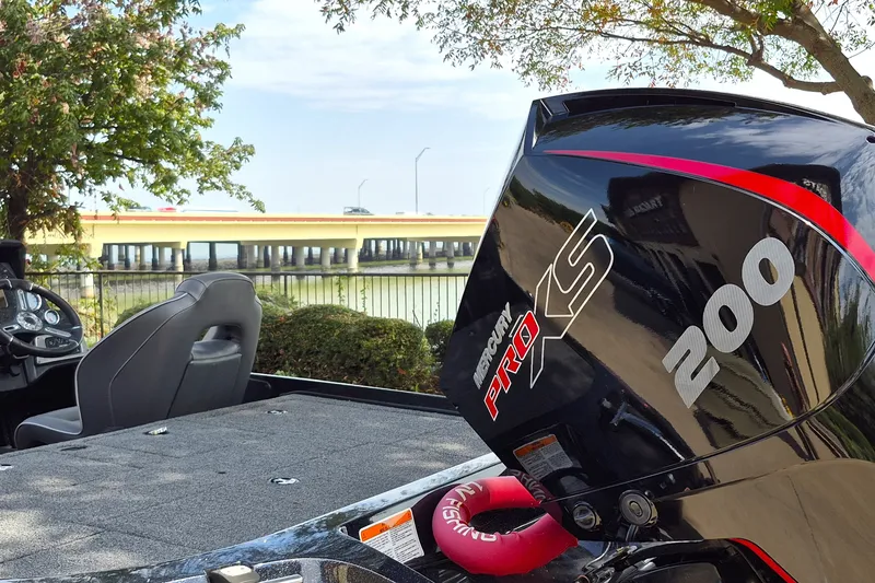 Slide: The Image of Nitro Z19 Pro 2020 boat with Mercury Pro XS 200 engine by a waterfront. - 9