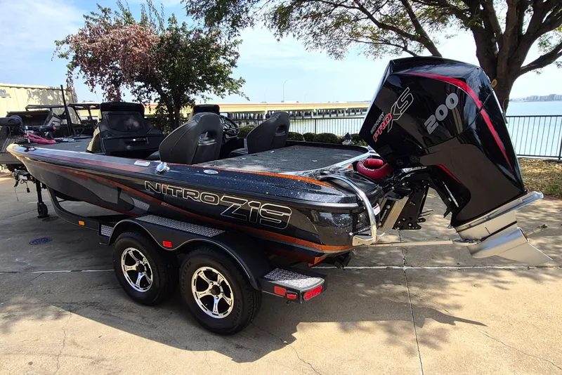 Slide: The Image of 2020 Nitro Z19 Pro boat with powerful 200 HP engine, parked near waterfront. - 8