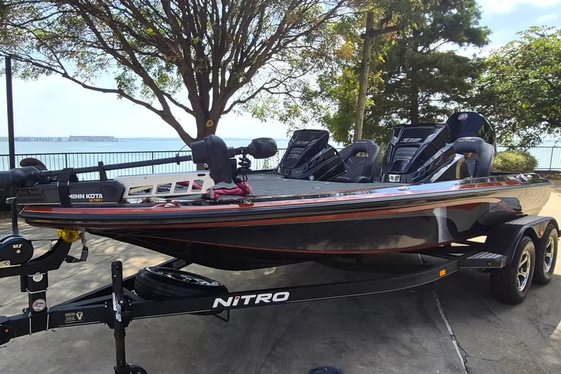 Slide: The Image of 2020 Nitro Z19 Pro fishing boat on trailer by lakeside. - 1