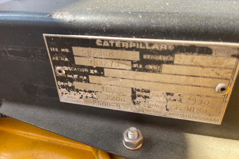Slide: The Image of Caterpillar engine plate on 1966 Webbers Cove 34, showing serial and specification details. - 49