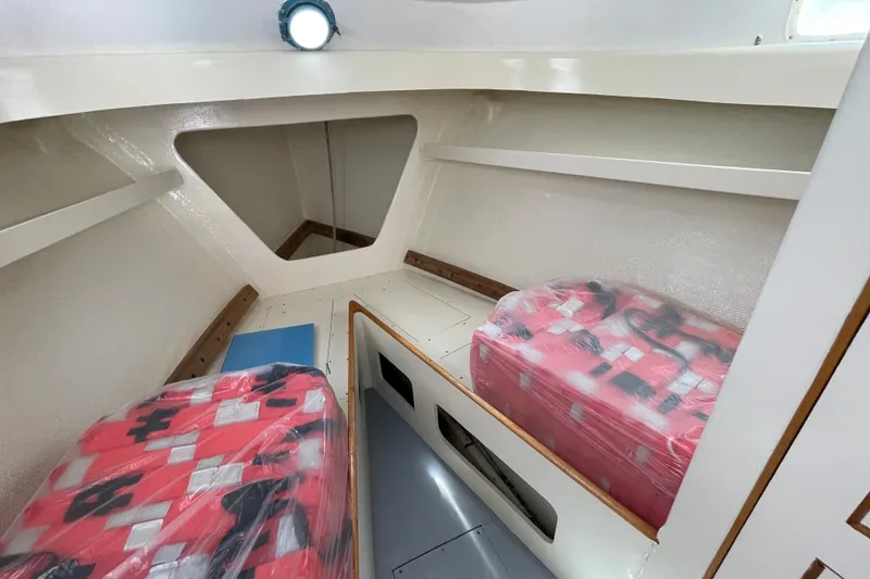 Slide: The Image of Interior cabin of a 1966 Webbers Cove 34 boat with twin berths. - 42