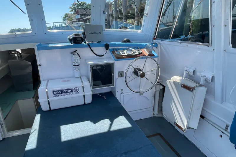 Slide: The Image of Interior of a 1966 Webbers Cove 34 boat with steering wheel and navigation equipment. - 29