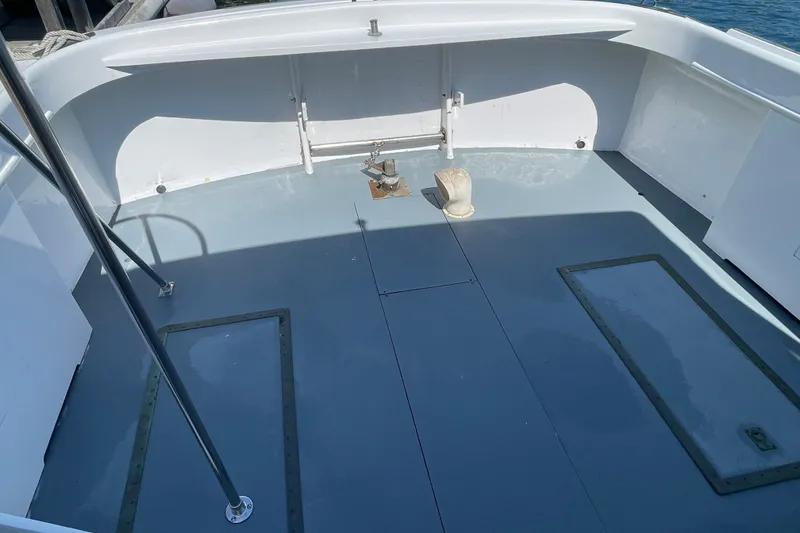 Slide: The Image of Deck of a 1966 Webbers Cove 34 boat, featuring a clean, spacious layout. - 25