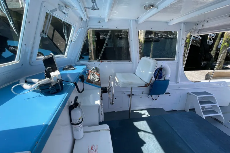 Slide: The Image of Interior of a 1966 Webbers Cove 34 boat with blue and white decor. - 37