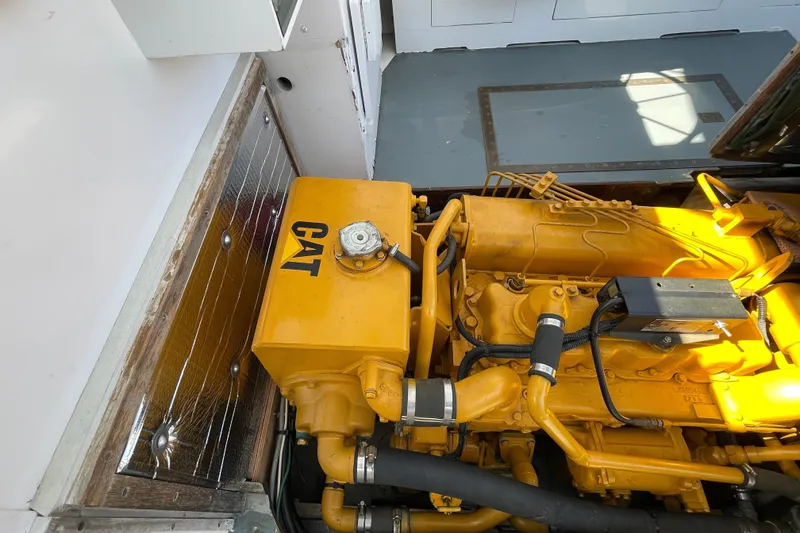 Slide: The Image of Yellow CAT engine inside a 1966 Webbers Cove 34 boat. - 50