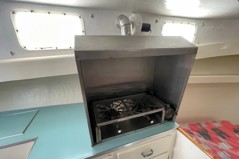 Slide: The Image of Vintage 1966 Webbers Cove 34 boat interior with stove and cabinetry. - 40
