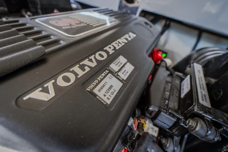 Slide: The Image of Volvo Penta engine in a 2010 Cobalt 302 boat, showcasing detailed components. - 52