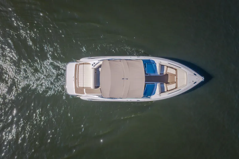 Slide: The Image of Overhead view of a 2010 Cobalt 302 boat cruising on water. - 7