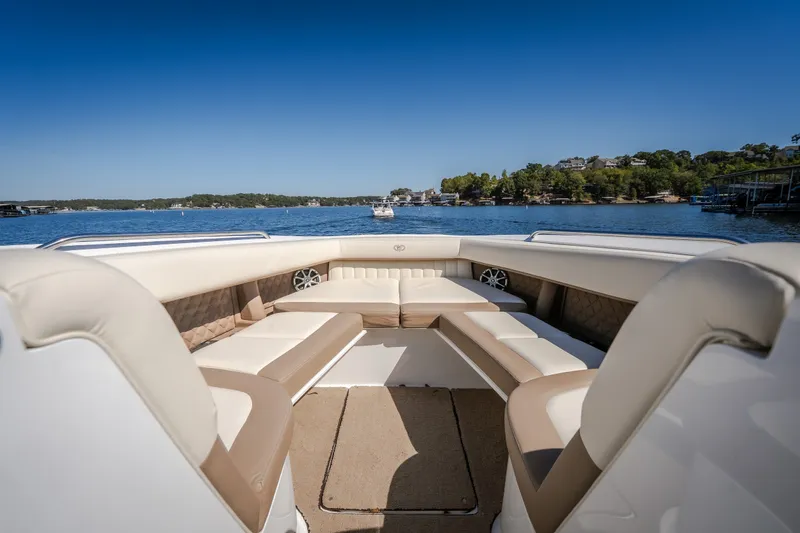 Slide: The Image of Luxurious seating on a 2010 Cobalt 302 boat, with scenic lake view. - 14