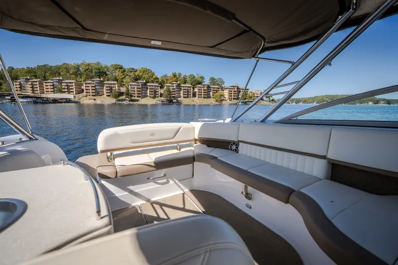 Slide: The Image of 2010 Cobalt 302 boat interior with lake view and waterfront buildings. - 28