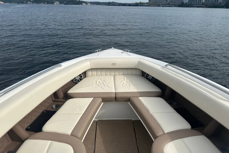 Slide: The Image of Luxurious seating on a 2010 Cobalt 302 boat, overlooking serene waters. - 8