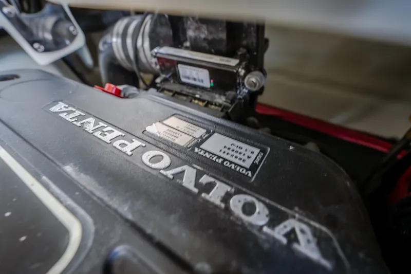 Slide: The Image of Volvo Penta engine in a 2010 Cobalt 302 boat, close-up view. - 53