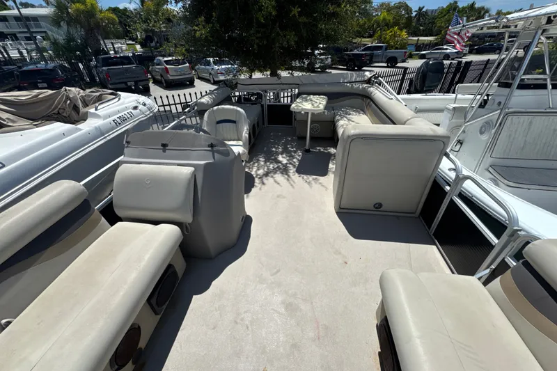 Slide: The Image of 2017 Godfrey Sweetwater Sunrise 22 pontoon boat interior with seating and helm. - 8