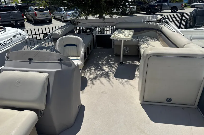 Slide: The Image of 2017 Godfrey Sweetwater Sunrise 22 pontoon boat interior with seating and table. - 7