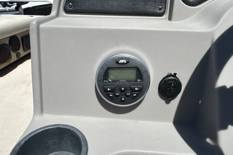 Slide: The Image of Control panel of a 2017 Godfrey Sweetwater Sunrise 22 boat with audio system. - 16