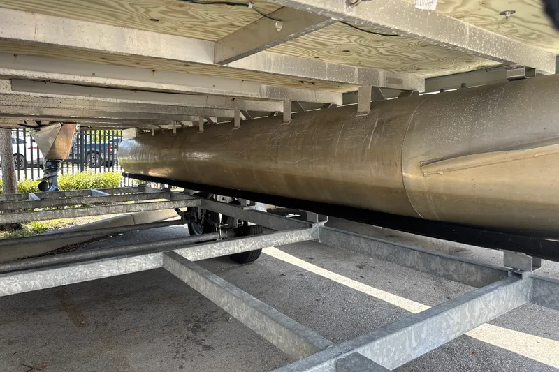 Slide: The Image of Underneath view of a 2017 Godfrey Sweetwater Sunrise 22 pontoon boat on a trailer. - 4