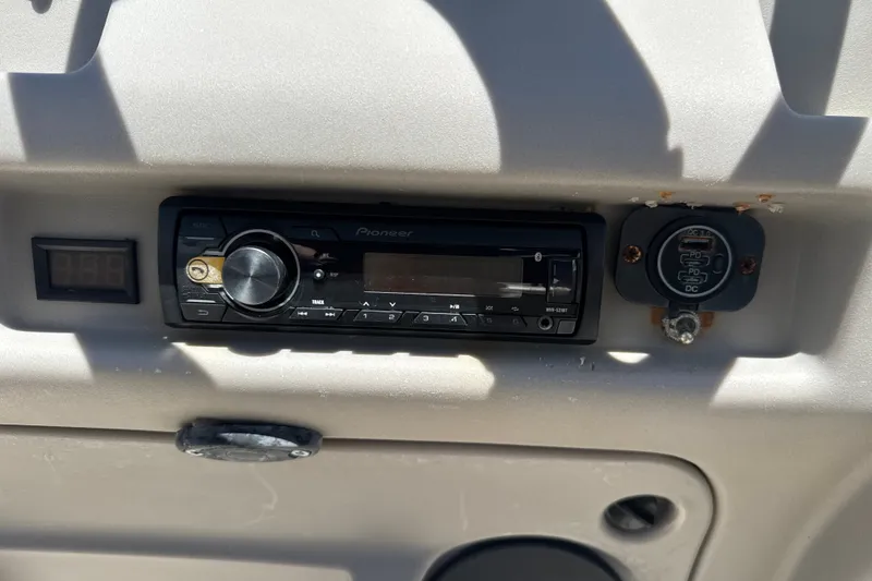 Slide: The Image of Control panel of a 2017 Godfrey Sweetwater Sunrise 22 with Pioneer stereo system. - 12