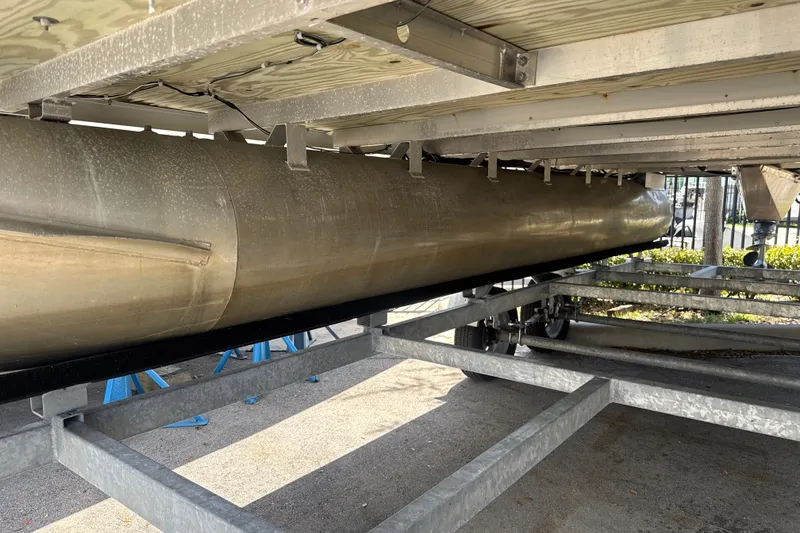 Slide: The Image of Underneath view of a 2017 Godfrey Sweetwater Sunrise 22 pontoon boat on a trailer. - 3