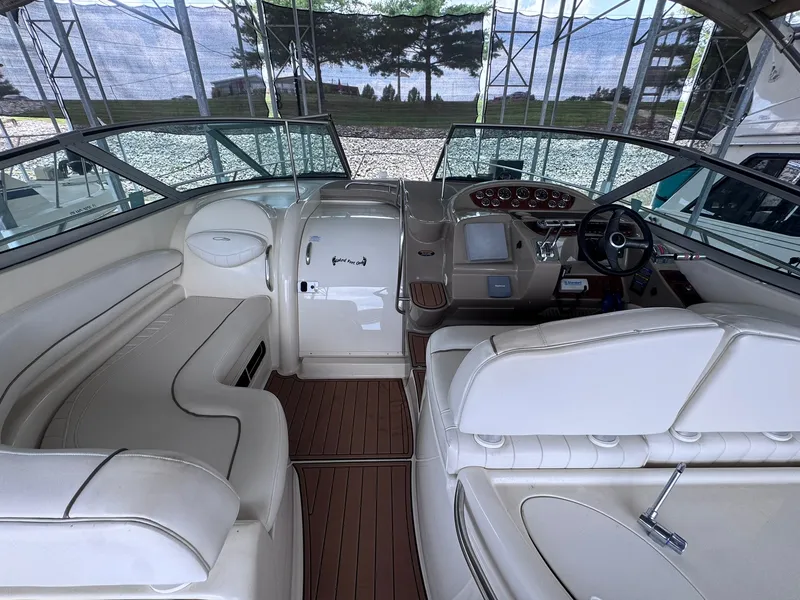 Slide: The Image of The image shows the cockpit of a 2001 Maxum 3500 SCR with white leather seating. - 8