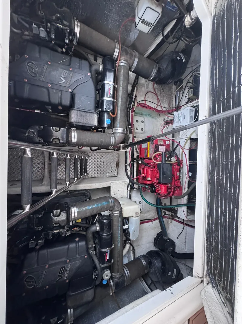 Slide: The Image of Engine compartment of a 2001 Maxum 3500 SCR with two engines and wiring. - 21