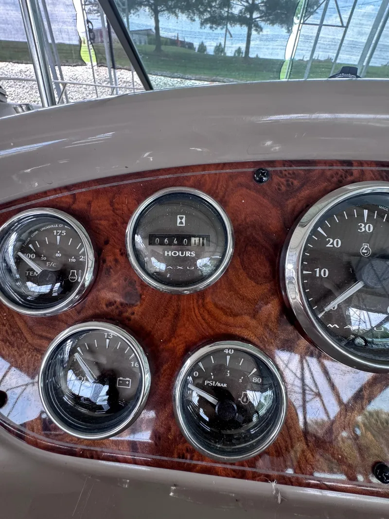Slide: The Image of The dashboard of a 2001 Maxum 3500 SCR displays various gauges and dials. - 19