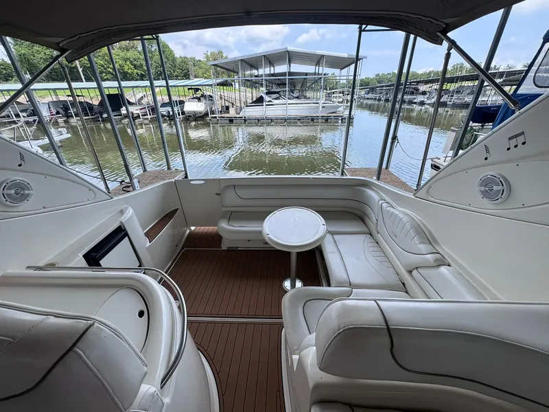 Slide: The Image of The image shows the cockpit of a 2001 Maxum 3500 SCR with white leather seating and a table. - 9