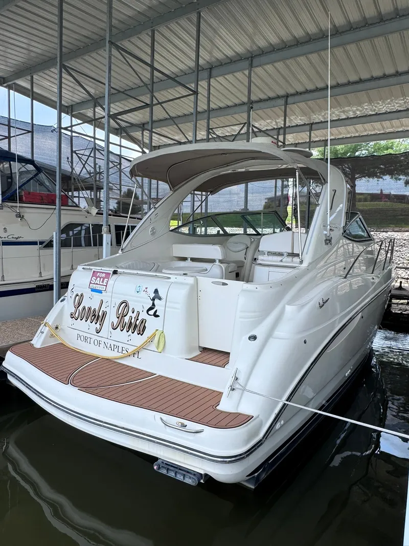 Slide: The Image of 2001 Maxum 3500 SCR at Port of Naples, featuring a spacious cockpit and covered berth. - 3
