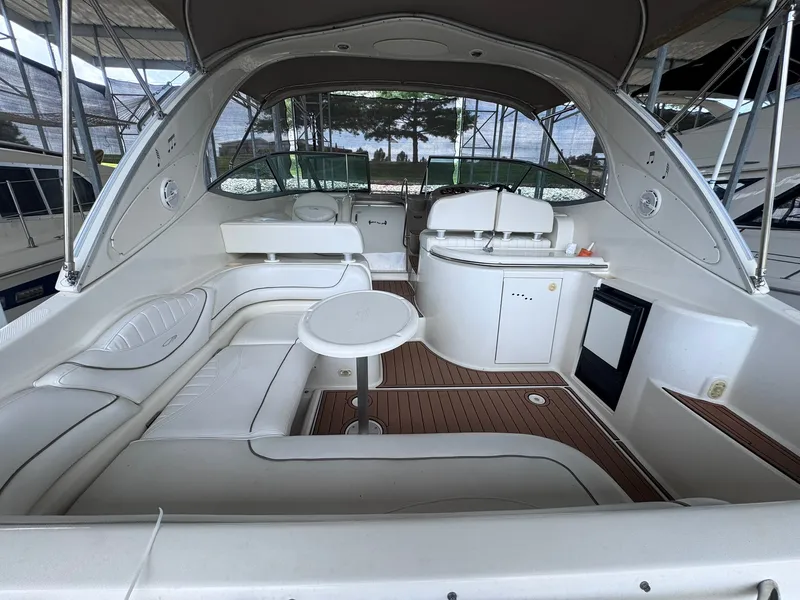 Slide: The Image of The image shows the cockpit of a 2001 Maxum 3500 SCR with white seating and wood flooring. - 4