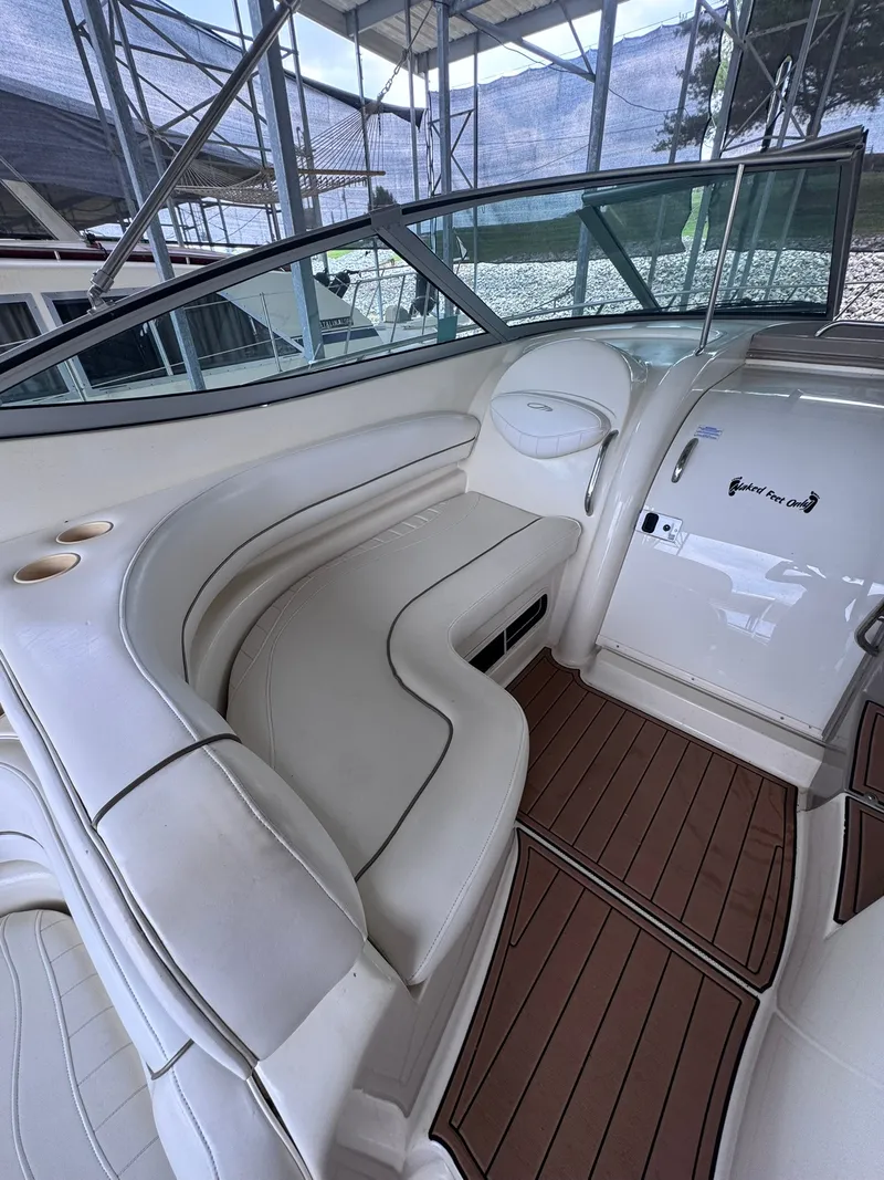 Slide: The Image of The image shows the cockpit of a 2001 Maxum 3500 SCR with white leather seating and wood flooring. - 7