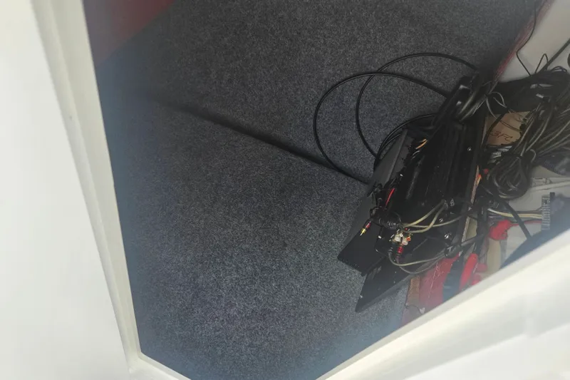 Slide: The Image of Interior view of a 2016 Yamaha AR240 boat with wiring and equipment. - 15