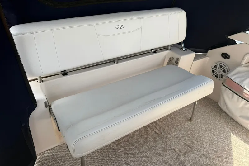 Slide: The Image of White seating area on a 2006 Regal 3360 Window Express boat interior. - 14