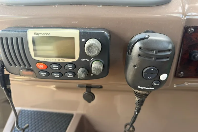 Slide: The Image of Raymarine VHF radio system on 2006 Regal 3360 Window Express boat dashboard. - 20
