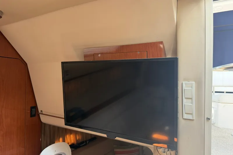 Slide: The Image of Flat-screen TV inside 2006 Regal 3360 Window Express boat cabin. - 34