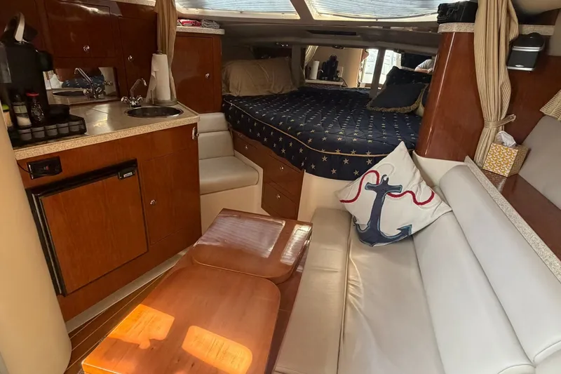 Slide: The Image of Interior of 2006 Regal 3360 Window Express yacht with kitchenette and cozy sleeping area. - 24