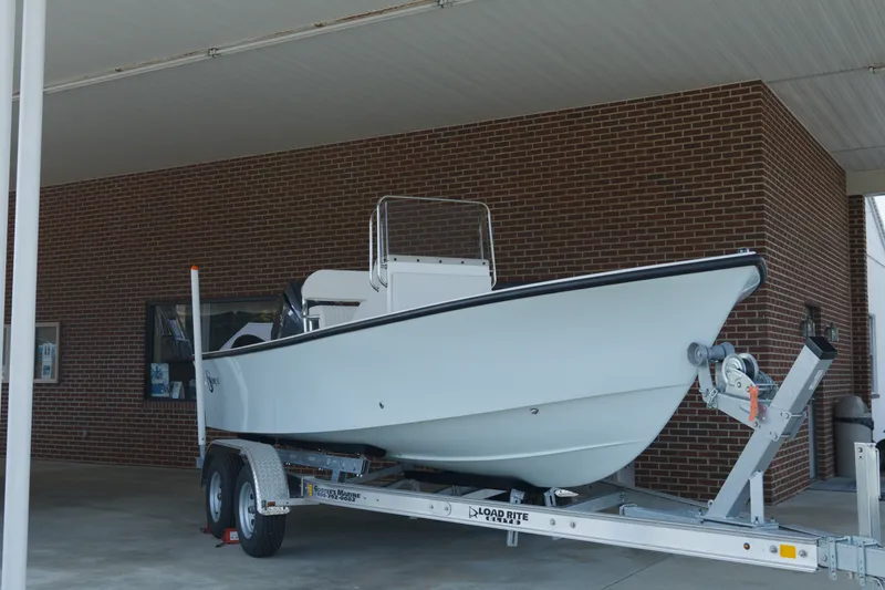 Slide: The Image of 2026 C-Hawk 20 Center Console boat on trailer, parked under a canopy. - 5