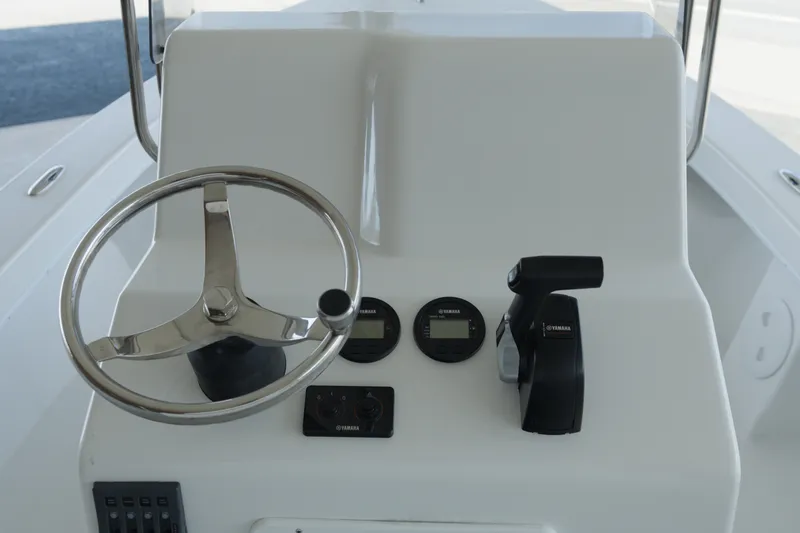 Slide: The Image of Steering console of 2026 C-Hawk 20 Center Console boat with Yamaha controls. - 7