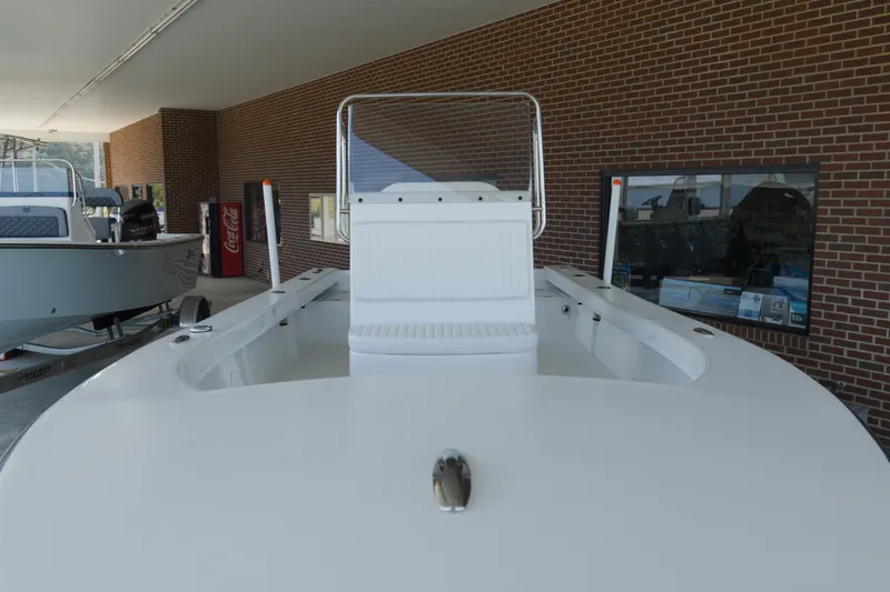 Slide: The Image of 2026 C-Hawk 20 Center Console boat displayed indoors, showcasing sleek design and spacious deck. - 6