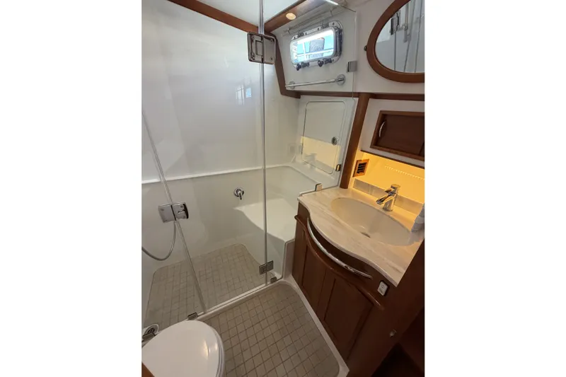 Slide: The Image of Luxurious bathroom in 2018 Sabre 48 Salon Express yacht with modern fixtures and elegant design. - 16