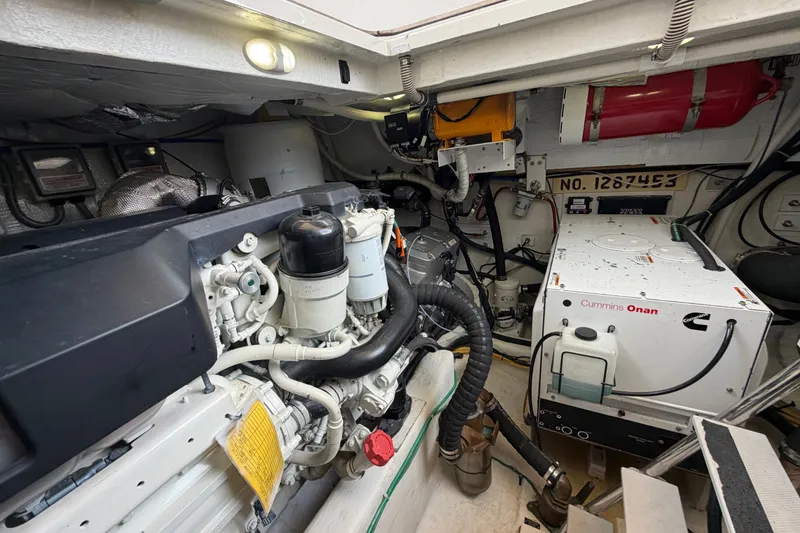 Slide: The Image of Engine room of 2018 Sabre 48 Salon Express with Cummins Onan generator. - 29