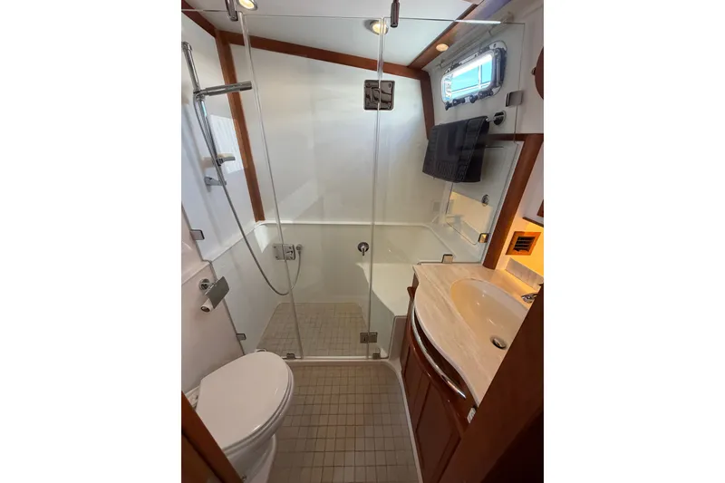 Slide: The Image of Luxurious bathroom in 2018 Sabre 48 Salon Express yacht with glass shower and modern fixtures. - 15