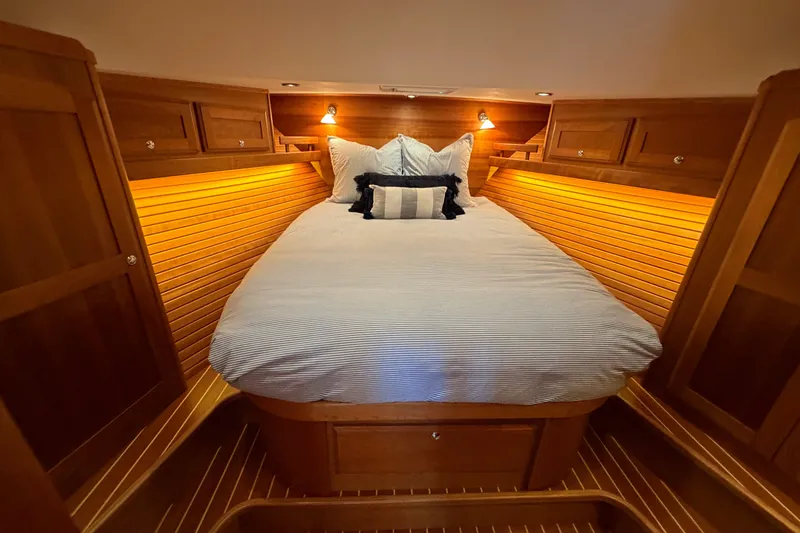 Slide: The Image of Luxurious cabin interior of 2018 Sabre 48 Salon Express yacht with cozy bedding. - 18