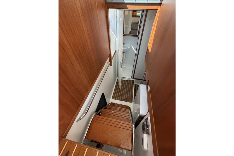 Slide: The Image of Interior view of 2018 Sabre 48 Salon Express yacht staircase and hallway. - 22