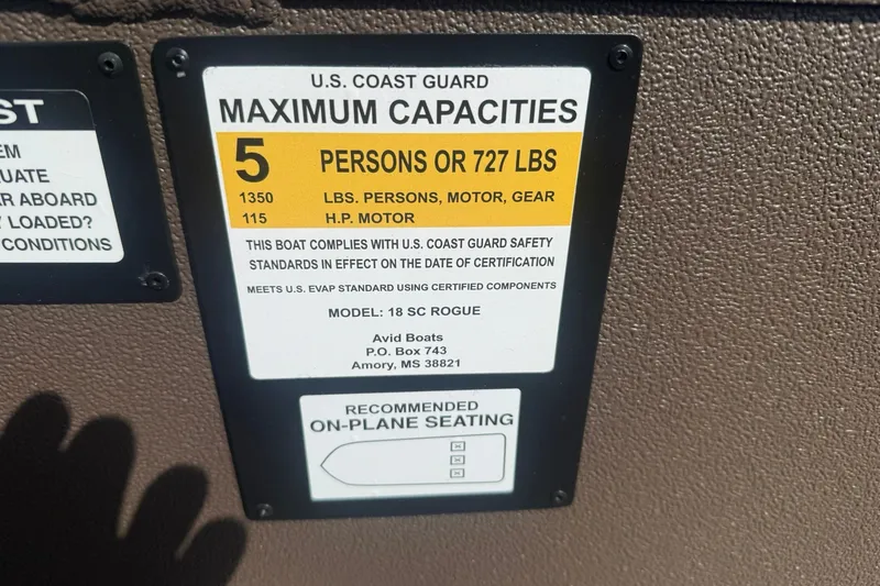 Slide: The Image of U.S. Coast Guard capacity label for Avid 18 Rogue SC, 2027 model, 5 persons or 727 lbs. - 14