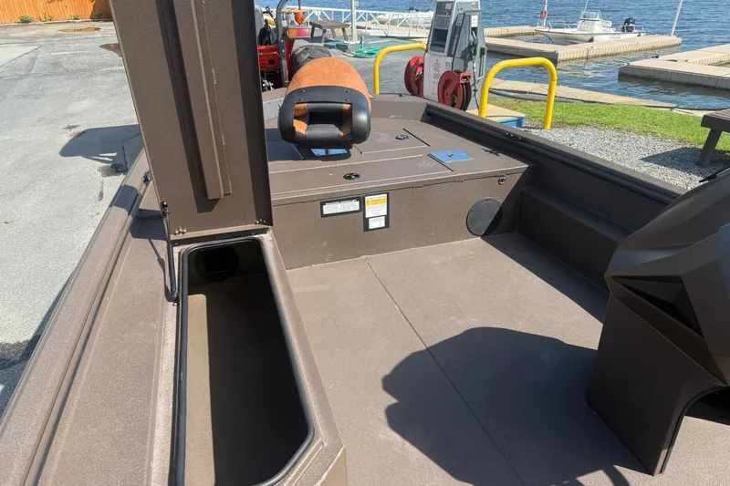 Slide: The Image of Interior view of 2027 Avid 18 Rogue SC boat at a dockside. - 12