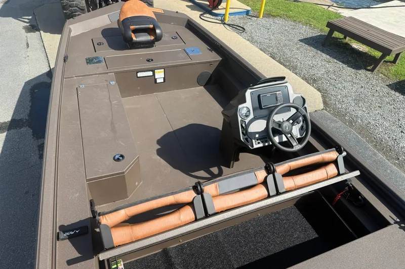 Slide: The Image of 2027 Avid 18 Rogue SC boat interior with steering console and seating. - 17