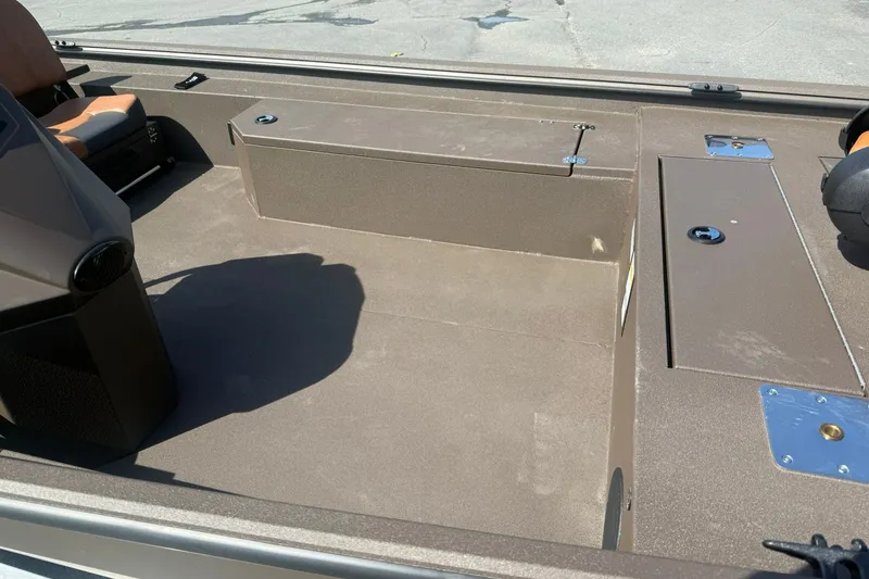 Slide: The Image of Interior of 2027 Avid 18 Rogue SC boat with seating and storage compartments. - 5