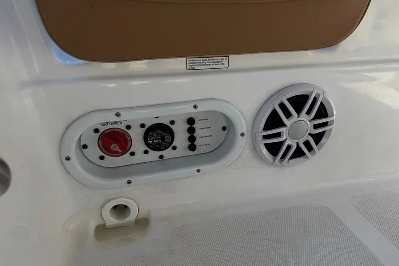Slide: The Image of 2024 NauticStar 211 Hybrid boat control panel and speaker detail. - 24