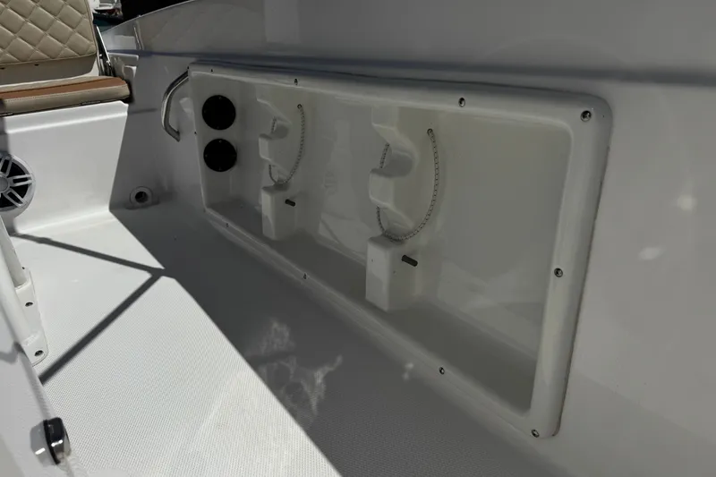 Slide: The Image of 2024 NauticStar 211 Hybrid boat interior with seating and storage compartments. - 18