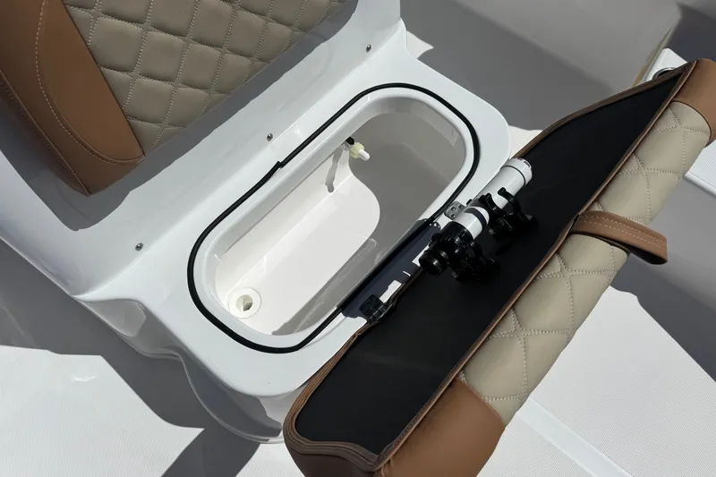 Slide: The Image of 2024 NauticStar 211 Hybrid boat seat with storage compartment and quilted upholstery. - 17